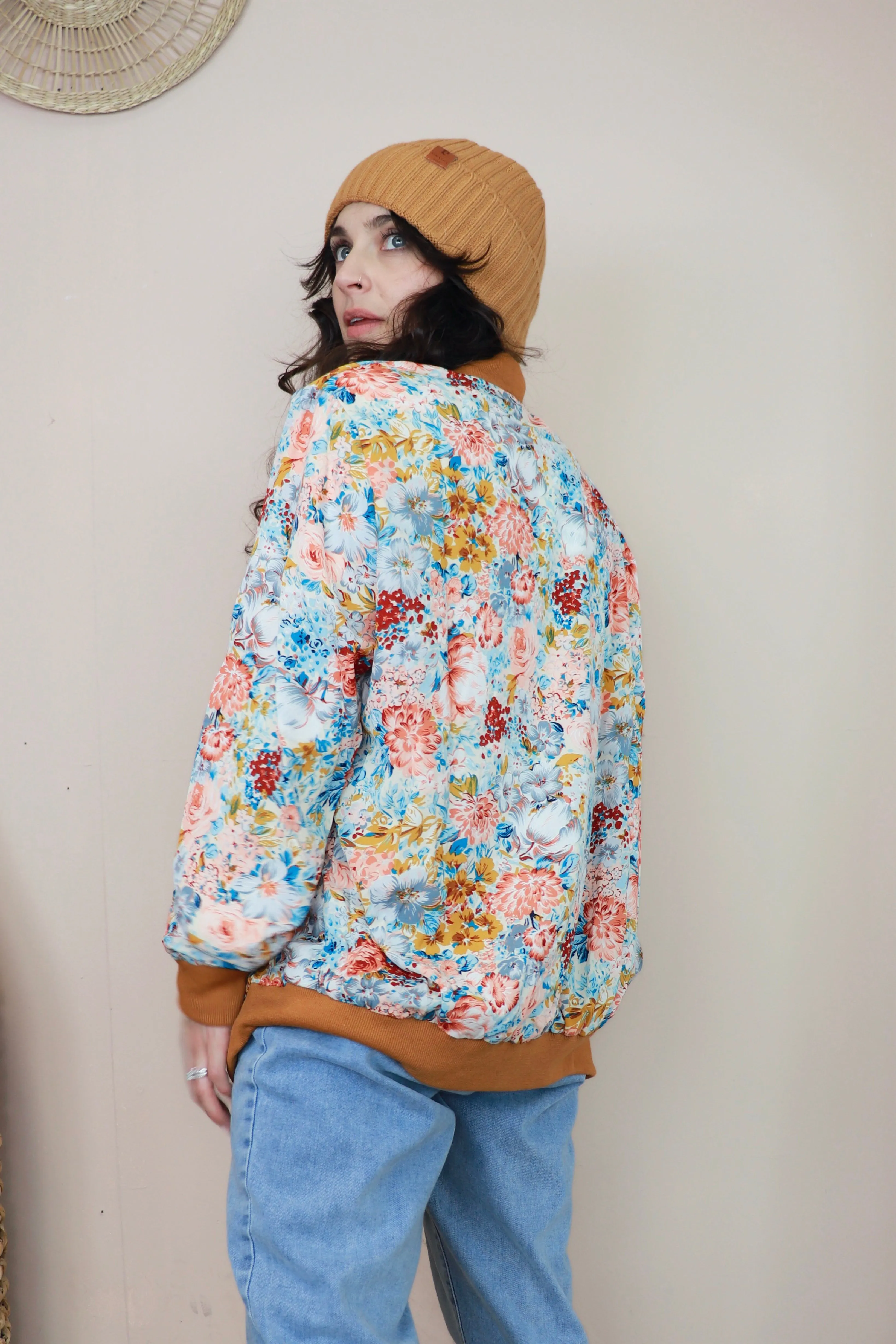 Floral bomber jacket with rust trim